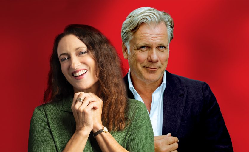 Woman clasping hands in green cardigan (Georgie Parker) and man (Erik Thomson) slightly behing in white shirt and black suit jacket.