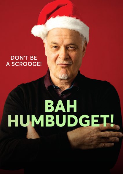 Bah Humbudget - Mark Kilmurry Artistic Director with Santa hat as Scrooge