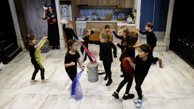 Students dancing with colored scarves